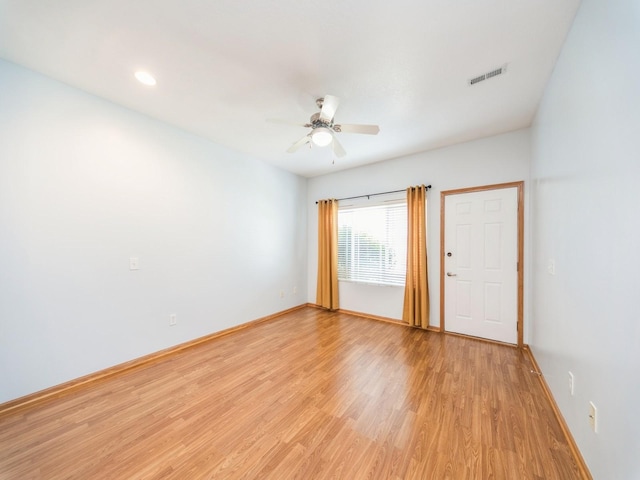 1155 NE 7th Ln, Ankeny, IA 50021 - empty room with light wood finished floors, ceiling fan, and recessed lighting