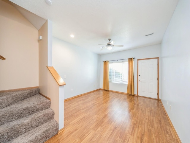 1155 NE 7th Ln, Ankeny, IA 50021 - empty room featuring stairway, ceiling fan, light wood-style floors, recessed lighting, and a smoke detector