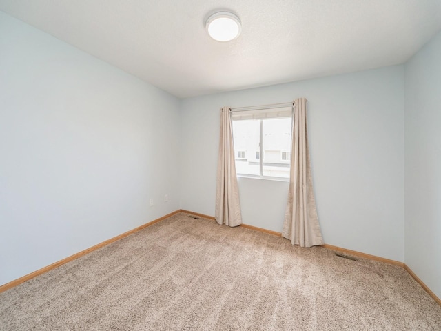 1155 NE 7th Ln, Ankeny, IA 50021 - spare room with light carpet and baseboards