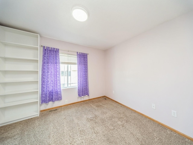 1155 NE 7th Ln, Ankeny, IA 50021 - spare room with carpet floors and baseboards