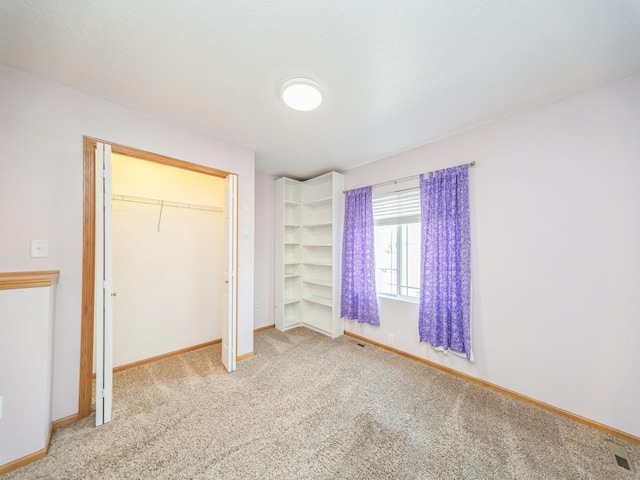 1155 NE 7th Ln, Ankeny, IA 50021 - unfurnished bedroom featuring carpet flooring and a closet