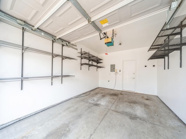 1155 NE 7th Ln, Ankeny, IA 50021 - garage featuring a garage door opener and electric panel