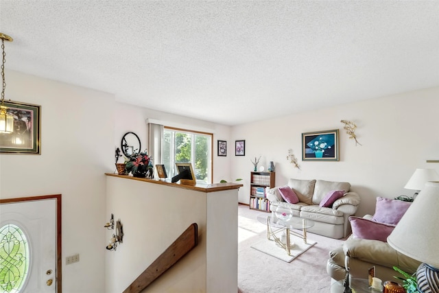 2434 SE 18th Ct, Des Moines, IA 50320 - living room with a textured ceiling and light carpet