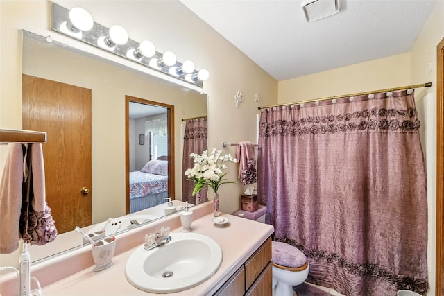 2434 SE 18th Ct, Des Moines, IA 50320 - ensuite bathroom featuring toilet and vanity