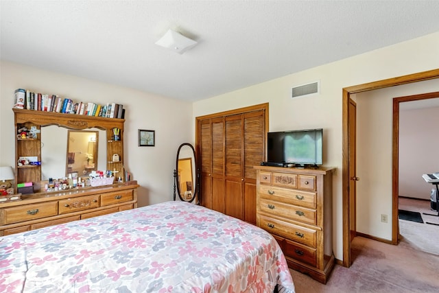2434 SE 18th Ct, Des Moines, IA 50320 - bedroom featuring light carpet and a closet