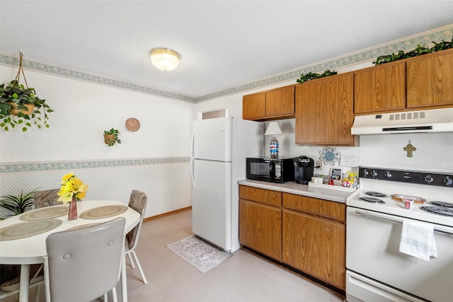 2434 SE 18th Ct, Des Moines, IA 50320 - kitchen with white appliances, ventilation hood, light countertops, brown cabinetry, and light floors