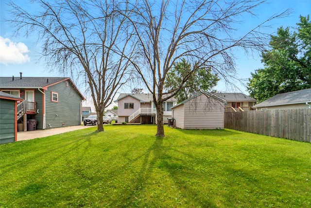 2434 SE 18th Ct, Des Moines, IA 50320 - view of yard featuring a residential view, an outbuilding, and stairway