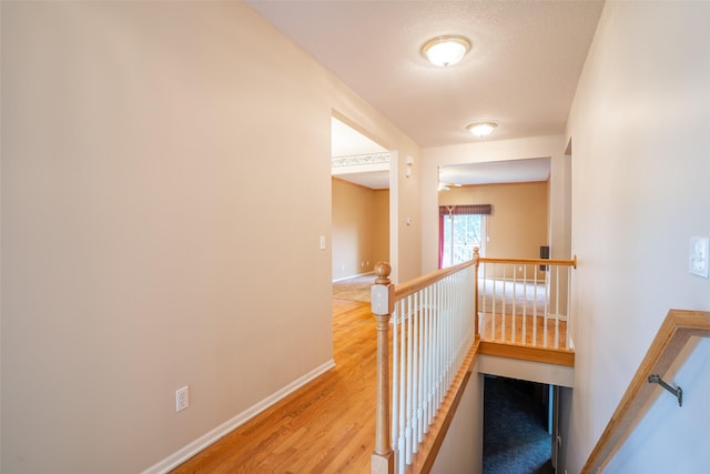 1422 SE Waywin Dr, Ankeny, IA 50021 - stairway featuring wood finished floors and baseboards