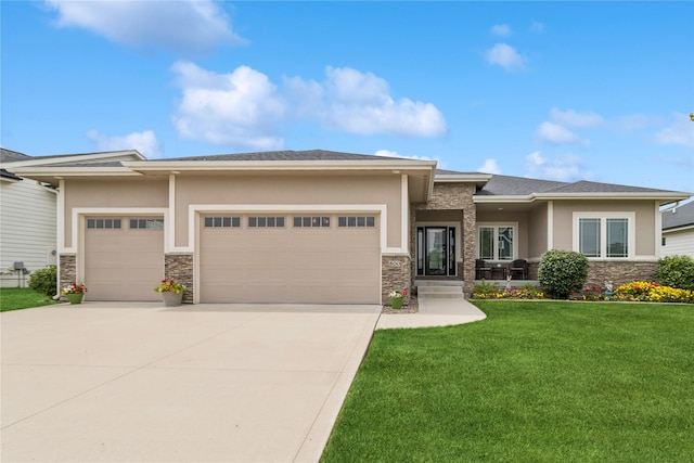 800 NE Badger Ln, Waukee, IA 50263 - prairie-style house featuring stone siding, an attached garage, stucco siding, and concrete driveway
