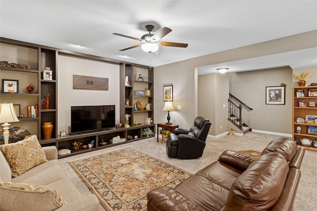 800 NE Badger Ln, Waukee, IA 50263 - carpeted living room featuring stairs and a ceiling fan