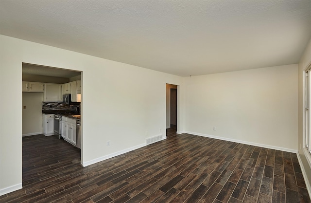 1213 NW Greenwood St, Ankeny, IA 50023 - unfurnished living room featuring dark wood-style flooring