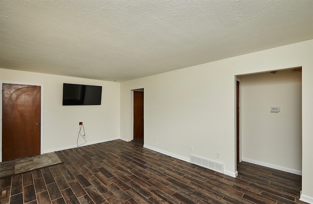 1213 NW Greenwood St, Ankeny, IA 50023 - empty room featuring wood finished floors and a textured ceiling