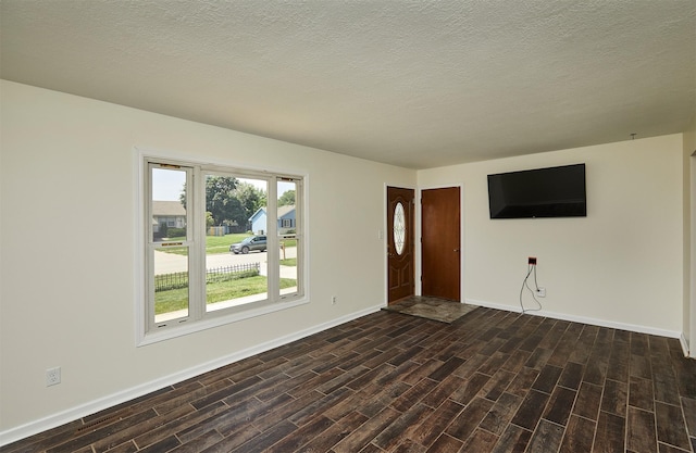1213 NW Greenwood St, Ankeny, IA 50023 - unfurnished living room with dark wood finished floors and a textured ceiling
