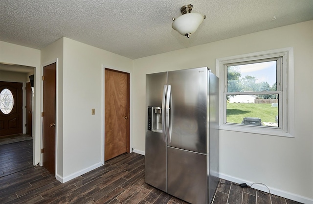 1213 NW Greenwood St, Ankeny, IA 50023 - kitchen with stainless steel fridge, dark wood-style floors, and a textured ceiling