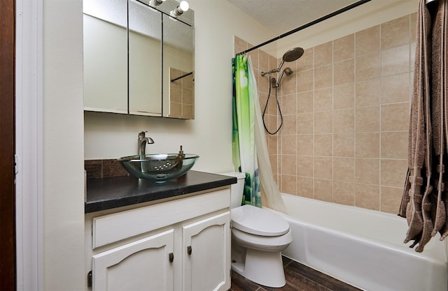 1213 NW Greenwood St, Ankeny, IA 50023 - bathroom featuring vanity, shower / bath combination with curtain, wood finished floors, and a textured ceiling