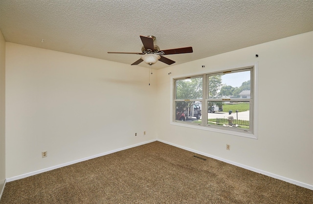 1213 NW Greenwood St, Ankeny, IA 50023 - spare room featuring dark carpet, ceiling fan, and a textured ceiling