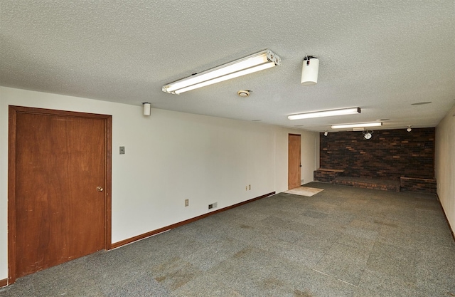 1213 NW Greenwood St, Ankeny, IA 50023 - finished basement with a textured ceiling and carpet floors