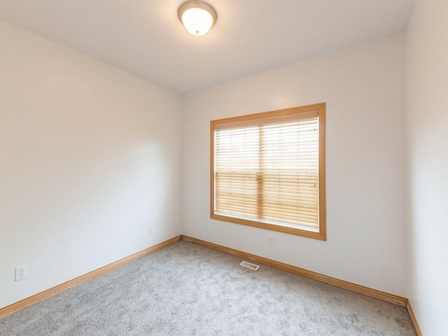 2227 4th Ave SE, Altoona, IA 50009 - spare room featuring carpet flooring