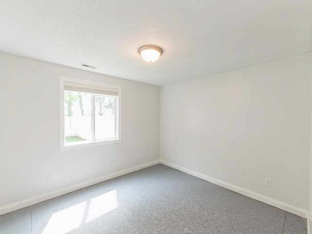 2227 4th Ave SE, Altoona, IA 50009 - spare room featuring baseboards