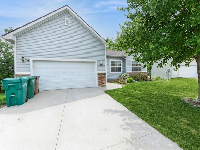 2227 4th Ave SE, Altoona, IA 50009 - ranch-style house featuring stone siding, a front lawn, driveway, and an attached garage