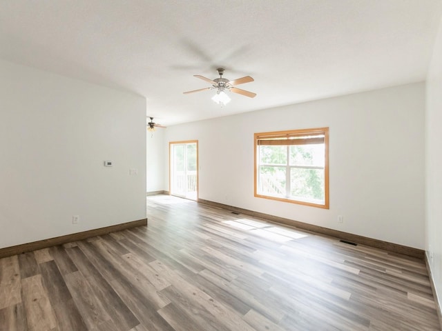 2227 4th Ave SE, Altoona, IA 50009 - empty room featuring a ceiling fan and wood finished floors