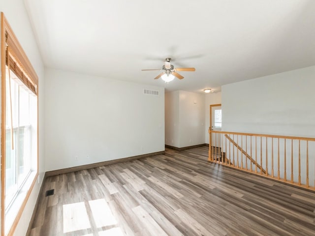 2227 4th Ave SE, Altoona, IA 50009 - empty room with ceiling fan and wood finished floors