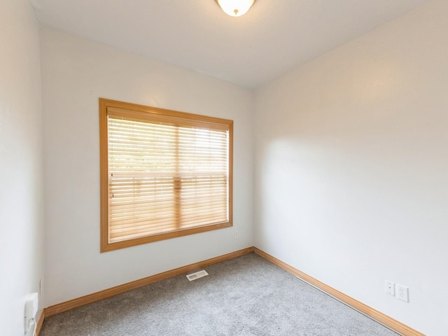2227 4th Ave SE, Altoona, IA 50009 - carpeted spare room with baseboards