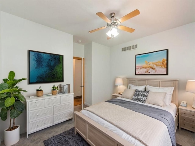 2227 4th Ave SE, Altoona, IA 50009 - bedroom with dark colored carpet and a ceiling fan