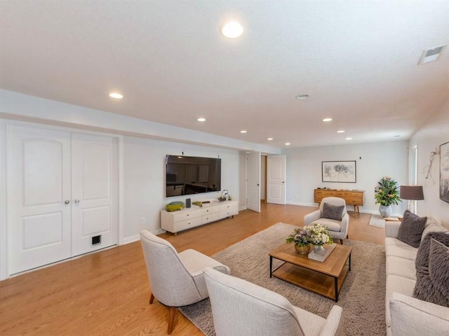 2227 4th Ave SE, Altoona, IA 50009 - living room featuring recessed lighting and light wood-style floors