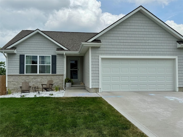 701 Patchett Dr, Mitchellville, IA 50169 - view of front facade with an attached garage, driveway, roof with shingles, a front yard, and stone siding