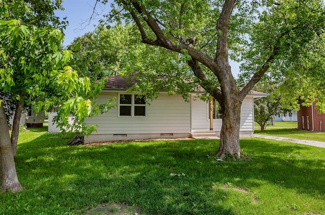 715 Maple St, Waukee, IA 50263 - view of property hidden behind natural elements with crawl space and a front yard