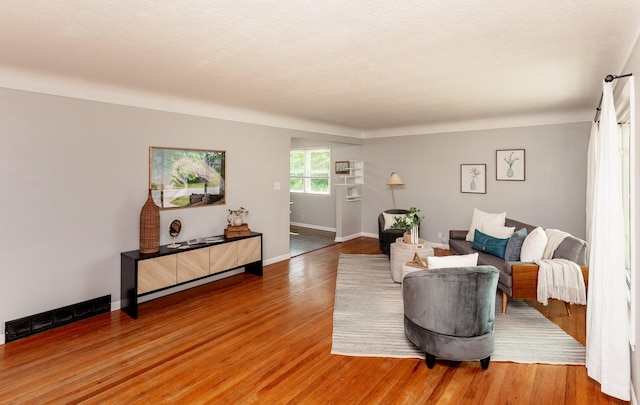 715 Maple St, Waukee, IA 50263 - living area featuring wood finished floors