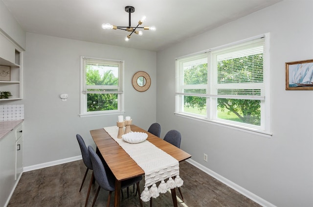 715 Maple St, Waukee, IA 50263 - dining area with a chandelier and dark wood-type flooring