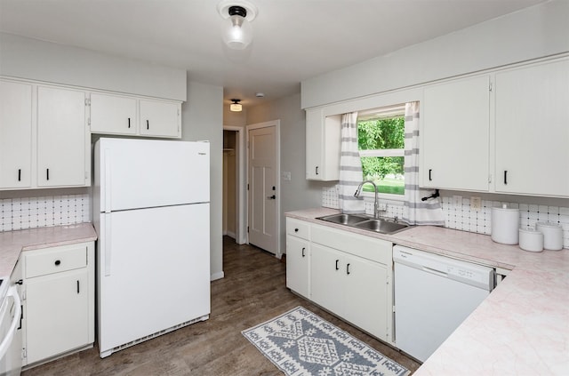 715 Maple St, Waukee, IA 50263 - kitchen with white appliances, light countertops, backsplash, and white cabinets