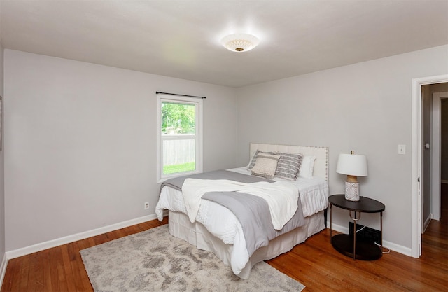 715 Maple St, Waukee, IA 50263 - bedroom with wood finished floors and baseboards
