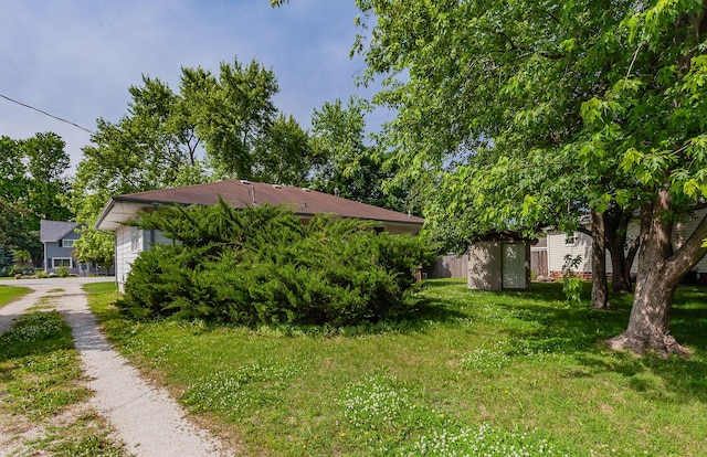 715 Maple St, Waukee, IA 50263 - view of green lawn featuring driveway