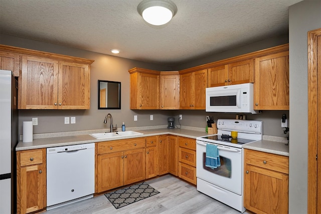 2014 Vista View Dr, Granger, IA 50109 - kitchen with white appliances, light wood-type flooring, a textured ceiling, light countertops, and recessed lighting