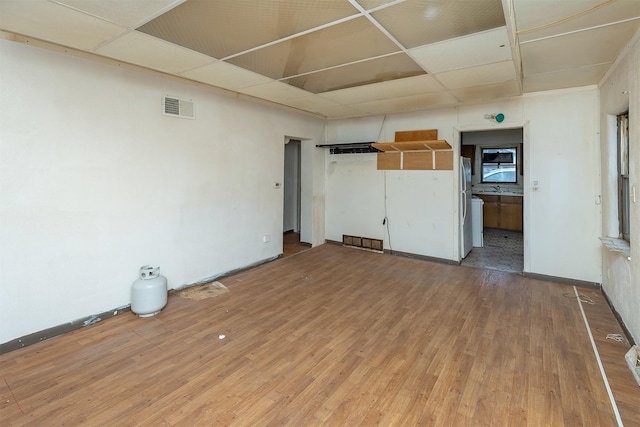 3120 Amherst St, Des Moines, IA 50313 - unfurnished living room featuring light wood finished floors and a sink