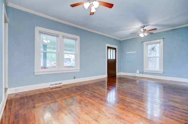 2736 College Ave, Des Moines, IA 50311 - empty room with ceiling fan, wood finished floors, ornamental molding, and a textured wall