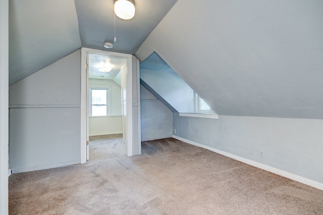 2736 College Ave, Des Moines, IA 50311 - additional living space with carpet flooring and vaulted ceiling