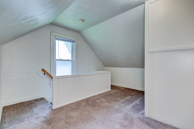 2736 College Ave, Des Moines, IA 50311 - bonus room with vaulted ceiling and carpet flooring