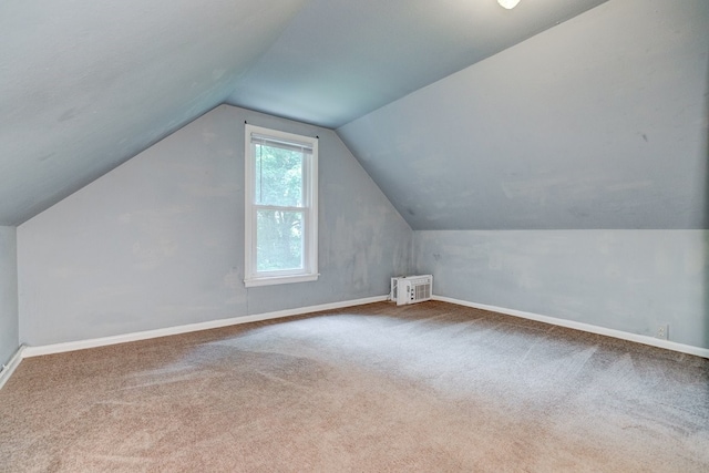 2736 College Ave, Des Moines, IA 50311 - additional living space with lofted ceiling and carpet