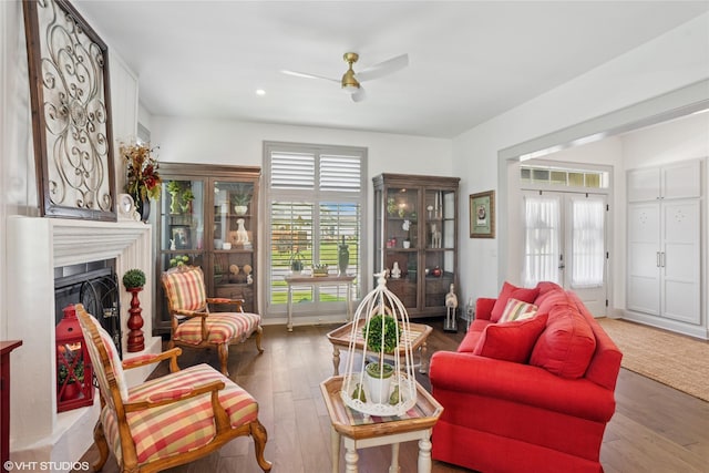 1811 SW Oak St, Ankeny, IA 50023 - living area featuring plenty of natural light, a ceiling fan, wood-type flooring, a fireplace, and recessed lighting