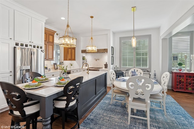 1811 SW Oak St, Ankeny, IA 50023 - dining room featuring dark wood-style flooring, recessed lighting, and a chandelier