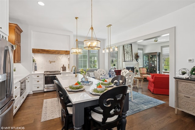 1811 SW Oak St, Ankeny, IA 50023 - dining area with a chandelier, dark wood-type flooring, healthy amount of natural light, and recessed lighting