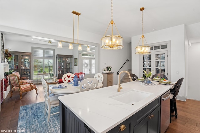 1811 SW Oak St, Ankeny, IA 50023 - kitchen featuring wood-type flooring, french doors, a chandelier, and open floor plan