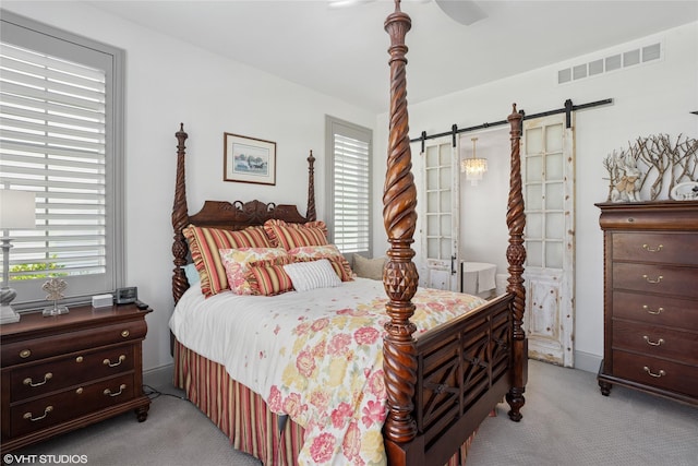 1811 SW Oak St, Ankeny, IA 50023 - bedroom featuring light carpet and a barn door