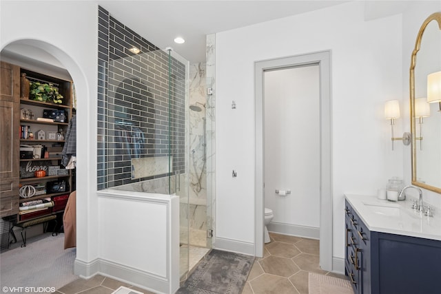 1811 SW Oak St, Ankeny, IA 50023 - full bathroom featuring a marble finish shower, vanity, tile patterned floors, and recessed lighting