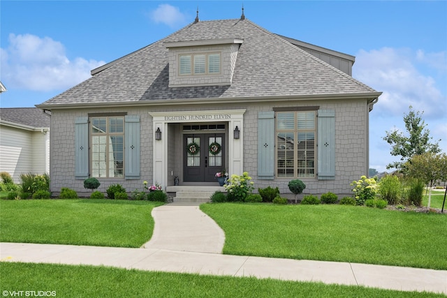 1811 SW Oak St, Ankeny, IA 50023 - view of front of home with french doors, roof with shingles, and a front lawn