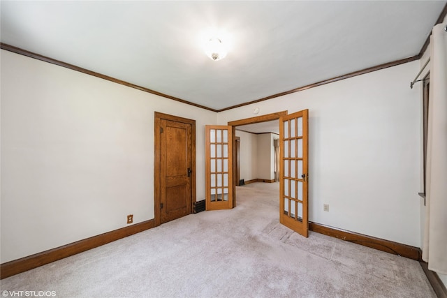 737 38th St, Des Moines, IA 50312 - spare room with french doors, crown molding, and carpet